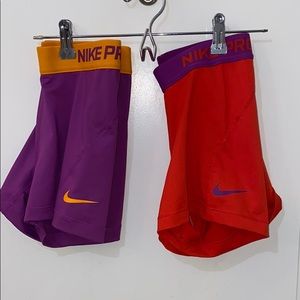 2 pairs of Colorful Nike pros